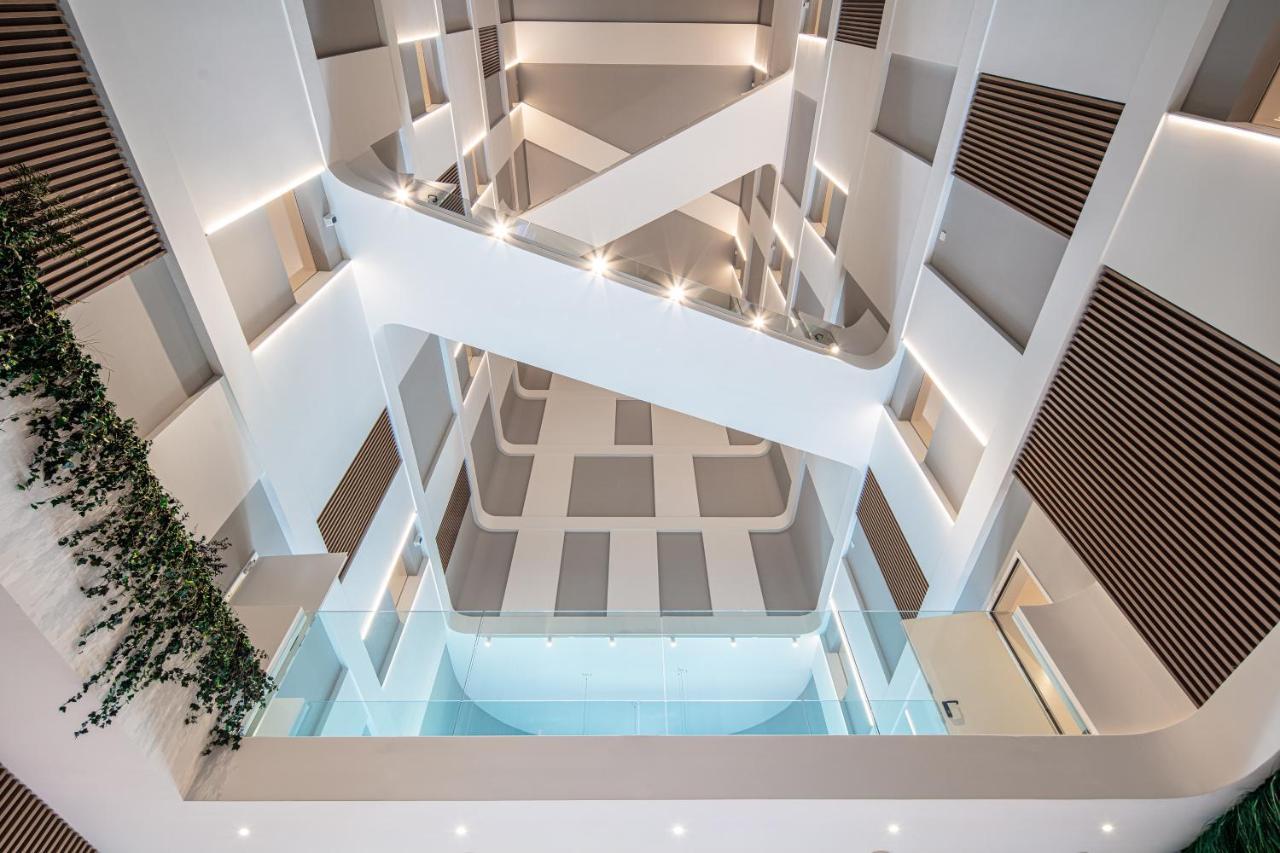 The One Caorle - Hotel & Apartments Esterno foto Interior of the library