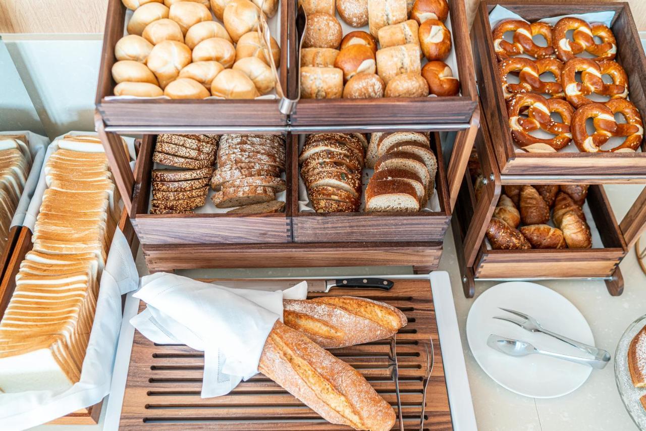 The One Caorle - Hotel & Apartments Esterno foto Bread and pastries